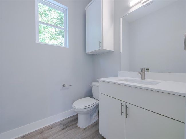 Bathroom with vanity and wood finished floors | Image 13