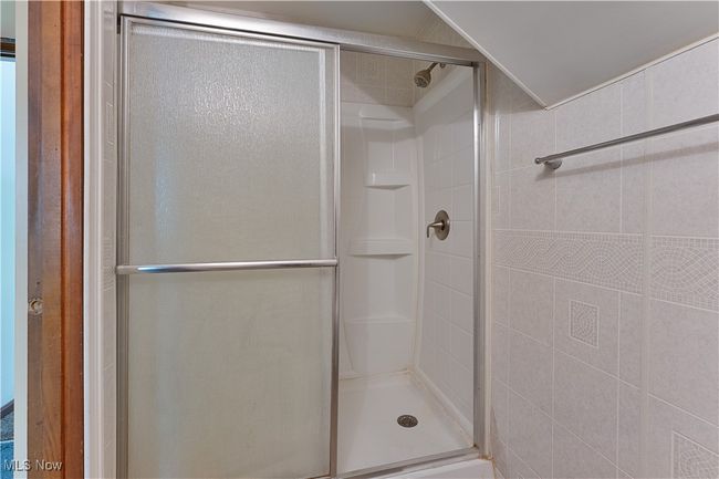 Bathroom with a stall shower | Image 27