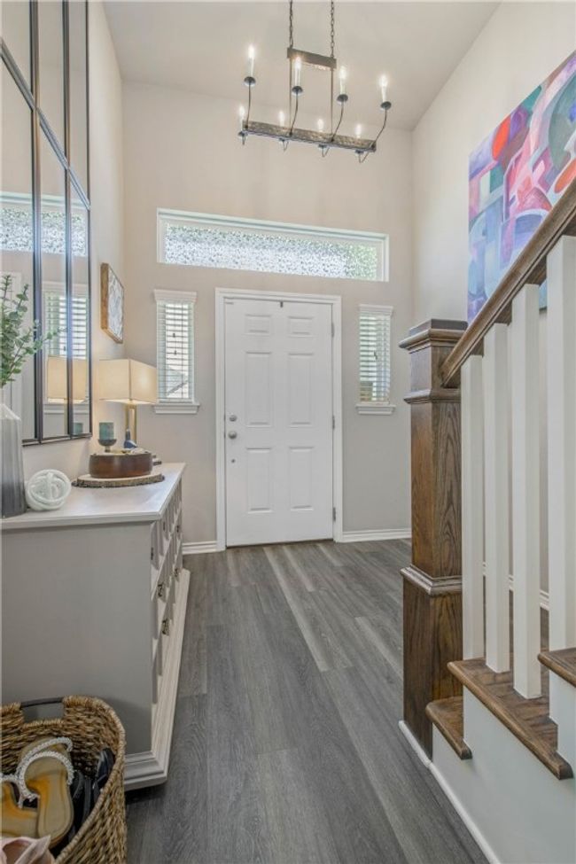 Entrance foyer with plenty of natural light and dark wood finished floors | Image 5