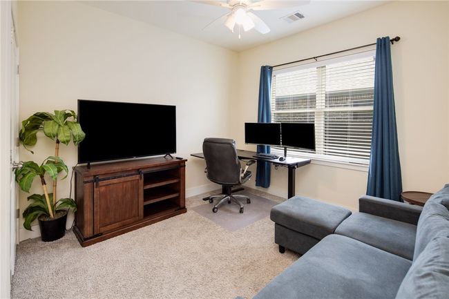 Carpeted office with ceiling fan and baseboards | Image 16