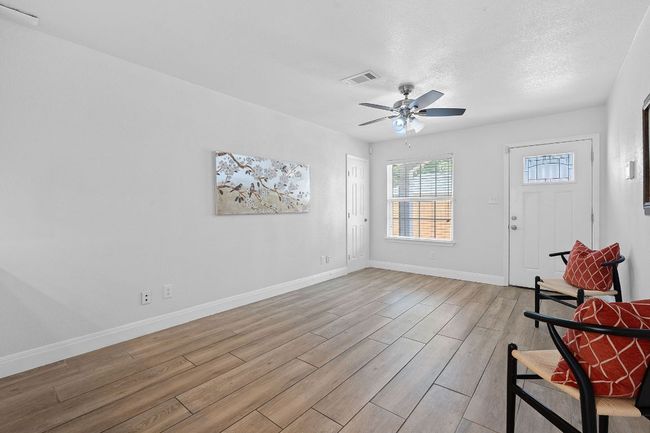 Entrance foyer with light wood-style flooring and a ceiling fan | Image 8