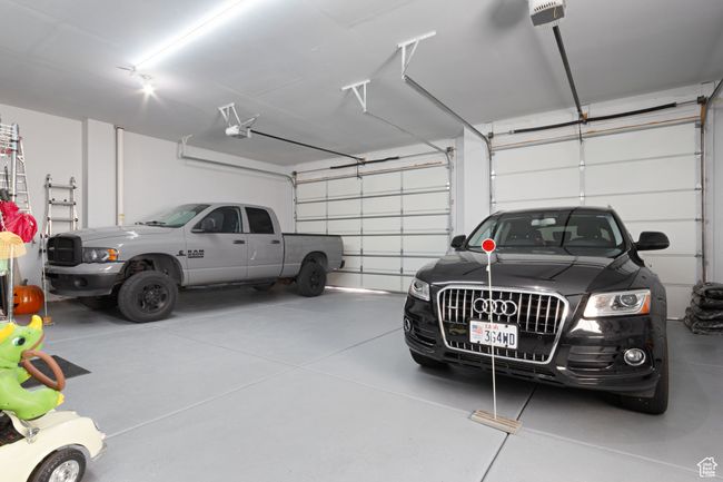 Garage featuring a garage door opener | Image 33