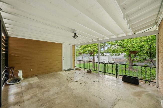 The back porch overlooks the expansive backyard. | Image 23