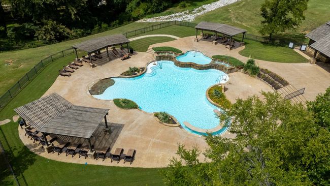 Community pool with a gazebo, a fenced backyard, and a patio area | Image 20
