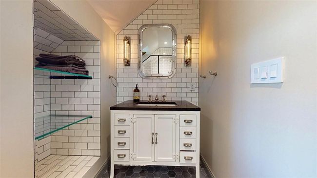 Bathroom featuring tile flooring and large vanity | Image 31