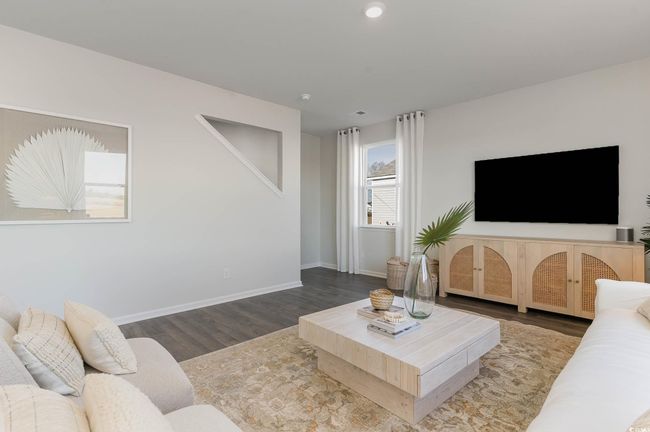 Living room featuring baseboards, recessed lighting, and wood finished floors | Image 5