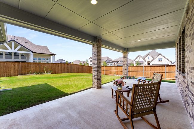 Fenced backyard featuring a patio and a residential view | Image 35