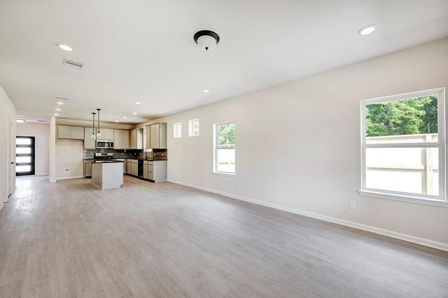 The Davenport II- Family Room into Kitchen. Home under construction. Sample floor plan photo used for illustrative purposes only. Upgrades, selections options, windows and colors may vary. | Image 6