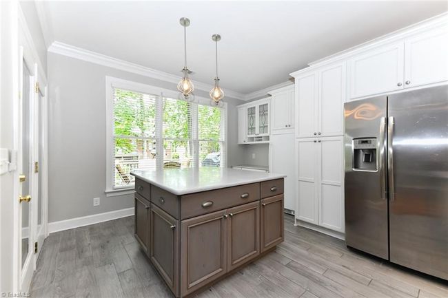 Lots of additional island storage combined with a second breakfast bar. | Image 9