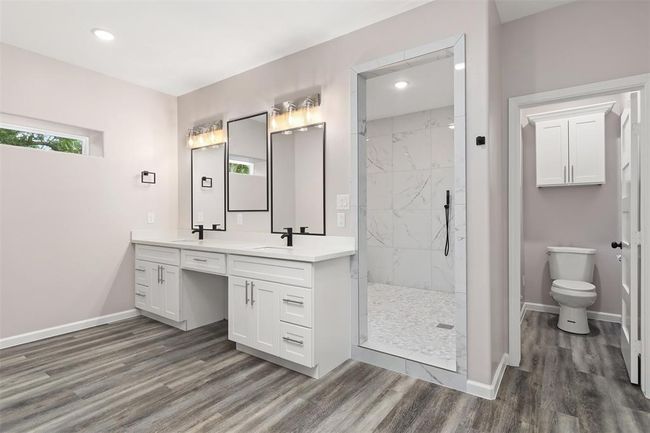 Oversized primary bathroom with dual vanities and MASSIVE shower room with stand alone tub | Image 17