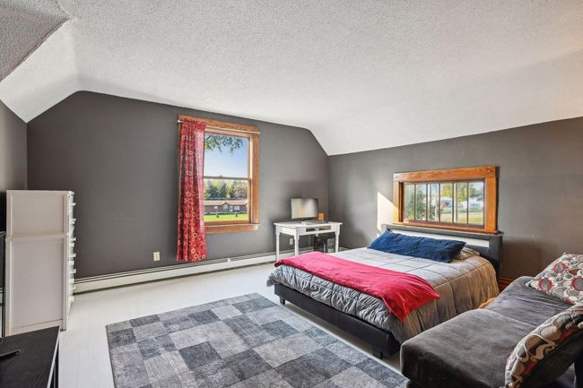 At the top of the stairs, you will find bedroom 2. This room looks out the front of the house and is South facing. | Image 39