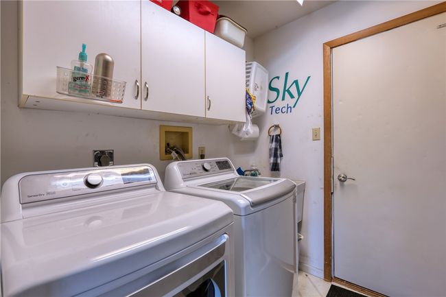 The laundry room/mudroom is on the main floor near the garage. | Image 8