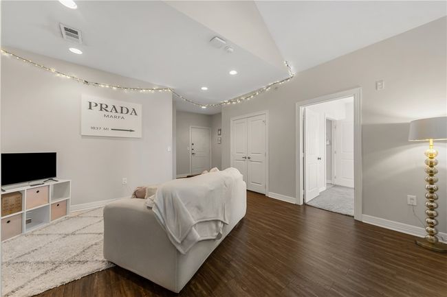 Living room with dark wood-type flooring | Image 25