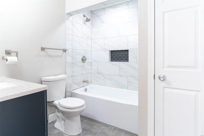 Full bathroom with vanity, toilet, and tiled floor , shower / bath | Image 23