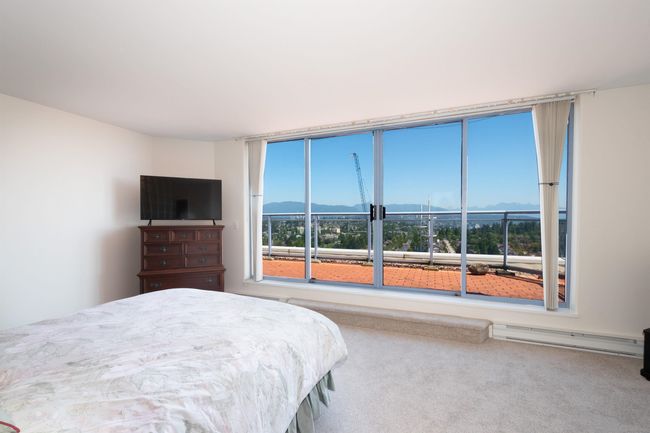 Bedroom featuring carpet and a baseboard radiator | Image 20