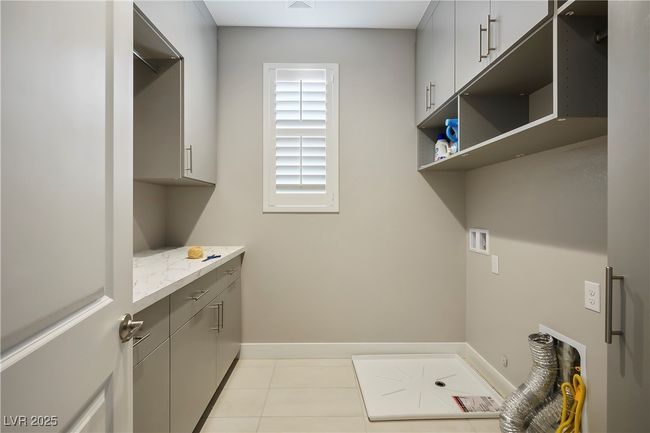 Upstairs Laundry Room, with Built-ins. | Image 37