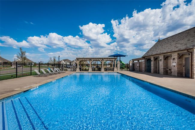 View of swimming pool with a pergola and a patio | Image 20