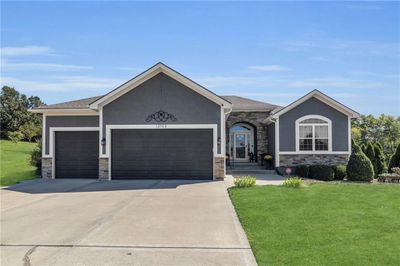 View of front of house with a front yard and a garage | Image 2