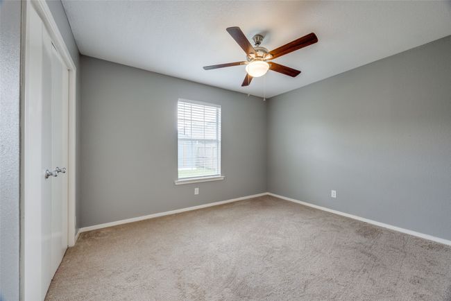 Unfurnished room with carpet and ceiling fan | Image 11
