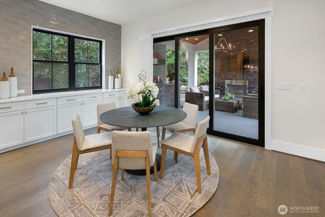 Casual Kitchen Nook that Expands into the Covered Patio. | Image 16