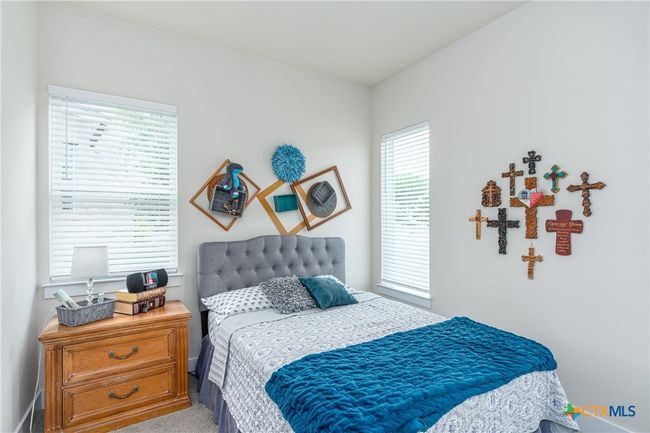 Front secondary bedroom with queen bed. | Image 23