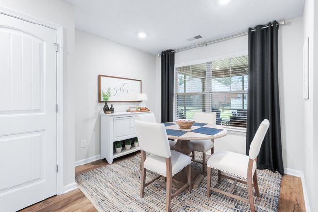 Cozy eat-in kitchen with a view of the patio and back yard. | Image 11