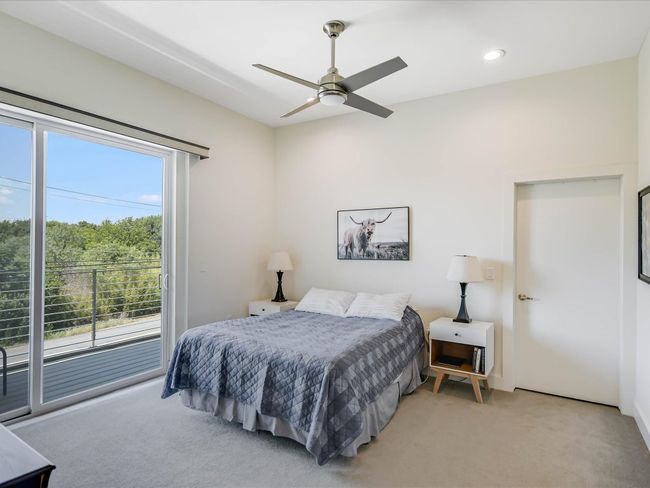 Bedroom with multiple windows, access to exterior, light carpet, a ceiling fan, and recessed lighting | Image 16