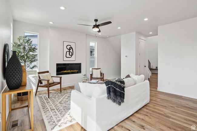 Living area featuring recessed lighting, light wood finished floors, and ceiling fan | Image 5