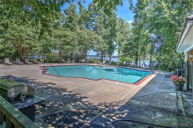 View of pool with a patio area | Image 19