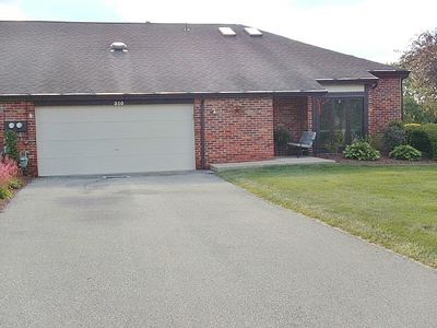 Maintenance free living with a Level Driveway to your 2 car attached garage and one little step to your front door! | Image 2