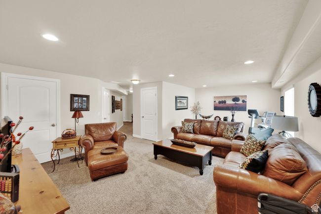 Carpeted living room featuring recessed lighting and baseboards | Image 23