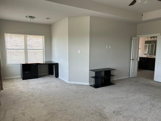 Spare room featuring carpet flooring, ceiling fan, and baseboards | Image 27