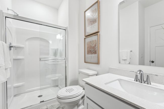 Photo is of the actual model. The main level bath. | Image 16