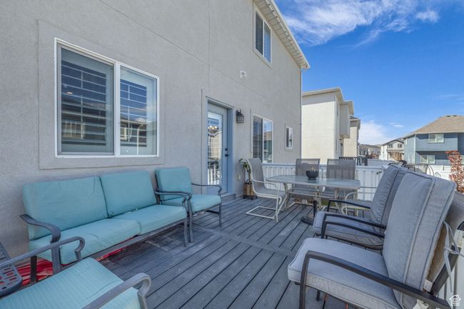 Wooden deck featuring an outdoor living space and outdoor dining space | Image 29