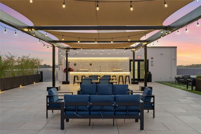 View of patio with an outdoor hangout area | Image 12