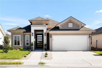 Prairie-style home featuring a garage | Image 1