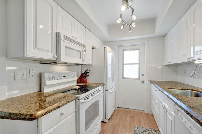 Beautiful granite countertops and plenty of kitchen cabinets | Image 15