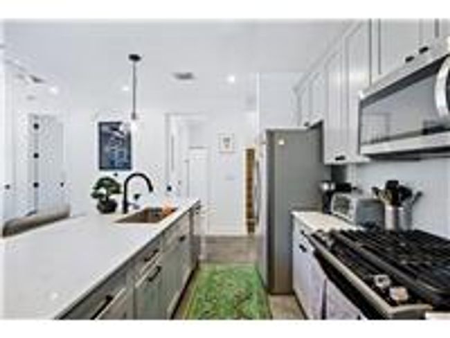 Kitchen featuring recessed lighting, stainless steel appliances, and concrete flooring | Image 12