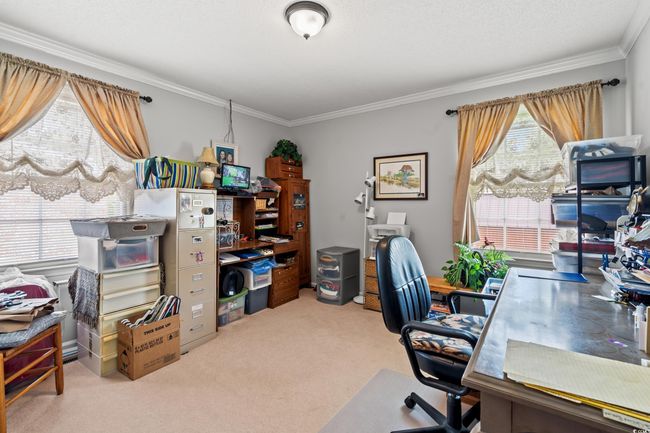 Carpeted office space featuring ornamental molding | Image 15