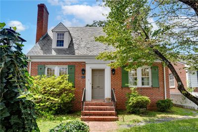 Classic Cape Cod with brick, slate roof, dormers and period shutters | Image 1