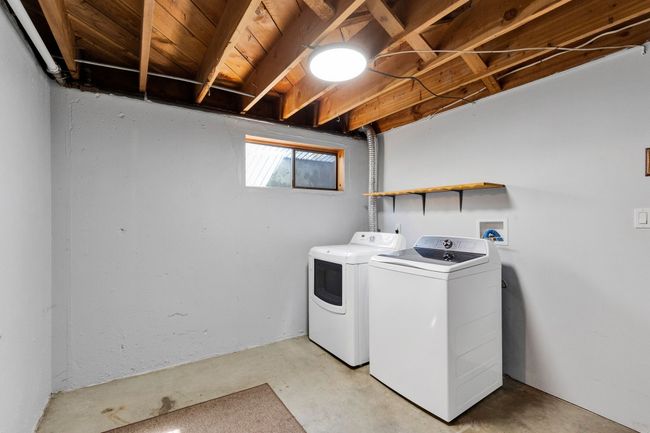 Bathroom featuring toilet, a stall shower, tile patterned flooring, and vanity | Image 32