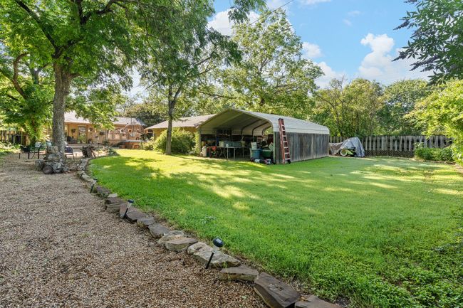 View of yard featuring a detached carport | Image 36