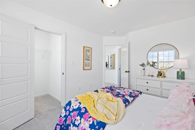 Carpeted bedroom with a closet | Image 26