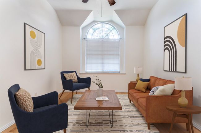 Living area with wood finished floors, ceiling fan, lofted ceiling, and baseboards | Image 20