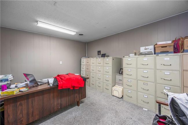 Office space with visible vents, a textured ceiling, and carpet floors | Image 21