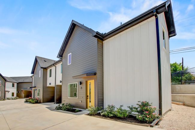 Contemporary home featuring board and batten siding, a patio area, and concrete driveway | Image 30