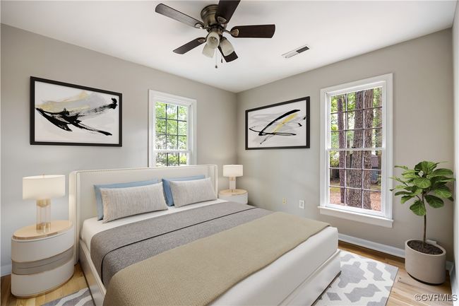 Bedroom with wood finished floors and a ceiling fan | Image 13