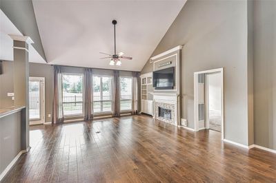 Wall of windows lets a ton of natural light into this family room | Image 2