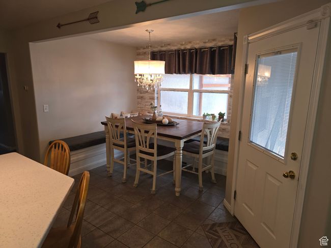 Dining room with a chandelier | Image 18