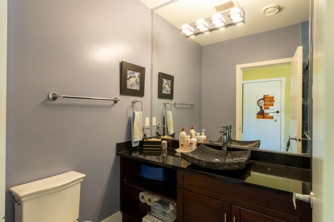 Bathroom with double vanity and toilet | Image 19